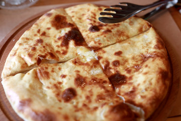 Megrelian Khachapuri on wooden board