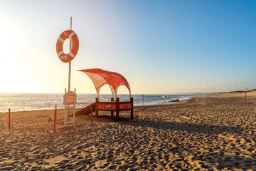 Porto, Portugal - 24 June 2019: Miramar beach ibb Porto. Lifeguard on the beach at sunset time