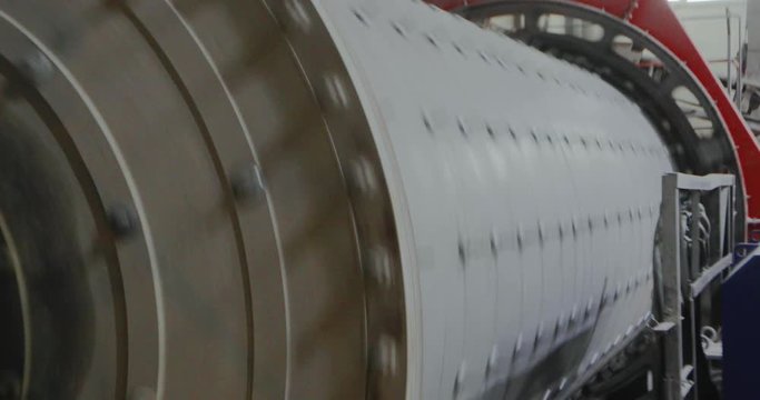 Grinding ore in a factory, grinding ore in a ball mill