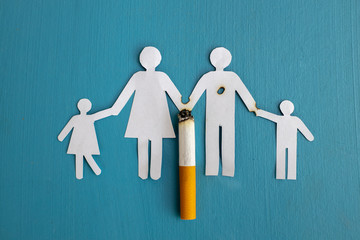 Paper cut of family destroyed by cigarettes. Drugs destroying family concept. Quit smoking for life on World no Tobacco day concept. World no tobacco day.advertisers.