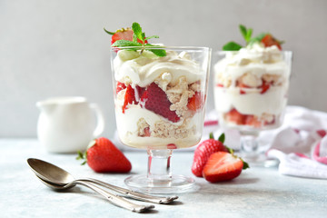 Eton mess - traditional english dessert with meringue, whipped cream and fresh berries.