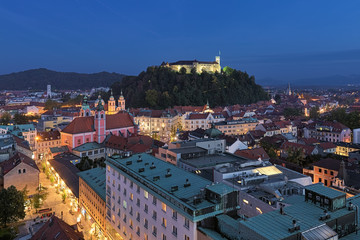 Ljubljana, Slovenia. High angle view on the historical part of the city in dusk. View from observation desk at the top floor of the Neboticnik building (The Skyscraper).