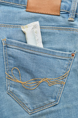 Female swab in the back pocket of jeans.