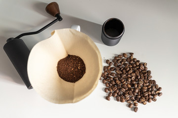 Coffee bean with grinder on white table
