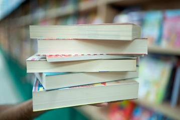 books stacked in the library