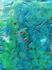 red pearls in blue green hot wax