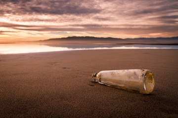 Bottle on the beach with important message