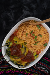 Vegetarian chiles rellenos cooked in eggless batter served with Mexican rice