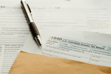 Fototapeta premium Individual income tax return form, income tax return form and pen on desk