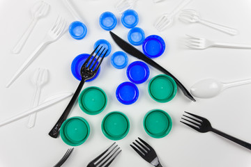 Plastic items. Plastic forks, knives, and corks. For the presentation of waste recycling. Disposable tableware