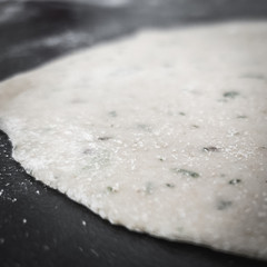 Indian wheat puri base prepared and ready for frying in oil . Good healthy indian breakfast