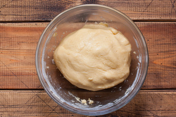 step-by-step cooking of traditional Jewish cookies with cinnamon Zemelah, step 2 - kneading dough, selective focus, top view