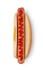 Hot dog with ketchup on white