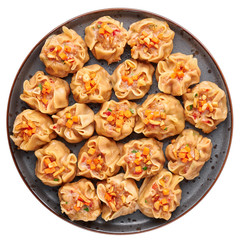 Shumai or Kanom Jeeb or Steamed Pork and Shrimp Dumplings on a black plate isolated on white backdrop. Shumai is a chinese cuisine dish with minced pork meat, shrimps, and vegetables. Chinese food