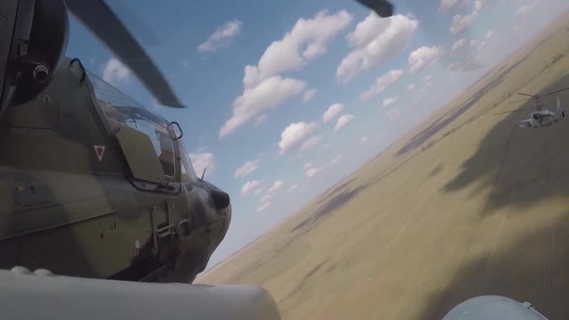 Ka-50 (product "800", according to NATO codification - Hokum A, known under the name "Black Shark" Ka-50 - Soviet / Russian single attack helicopter, during the flight. (GoPro)