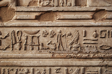 Ancient hieroglyph and relief on the wall of a Temple in Egypt
