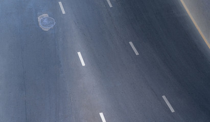 Aerial photo top view over empty traffic street road in city