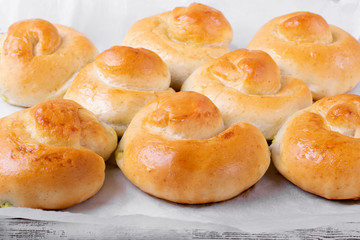 Yeast buns with filling on the parchment paper