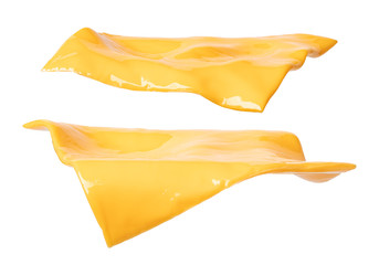 pieces of cheddar cheese on a white background - obrazy, fototapety, plakaty