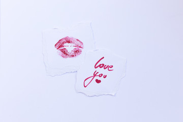 Declaration of love, postcard, kiss, stamp, calligraphy, red marker. I love you. A message written by lipstick. Love card with lip prints.