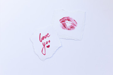 Declaration of love, postcard, kiss, stamp, calligraphy, red marker. I love you. A message written by lipstick. Love card with lip prints.
