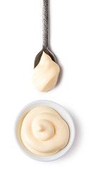 Bowl and spoon with mayonnaise