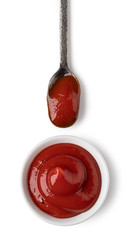 Bowl and spoon with ketchup sauce