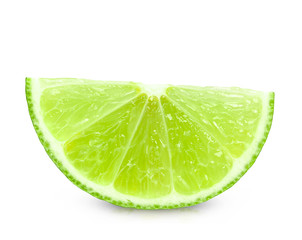 Fototapeta na wymiar Ripe wedge of green lime citrus fruit isolated on white background. Lime slice with clipping path