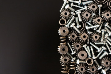 Mechanical components on black background. Industrial objects