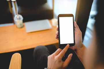 man using smartphone at cafe