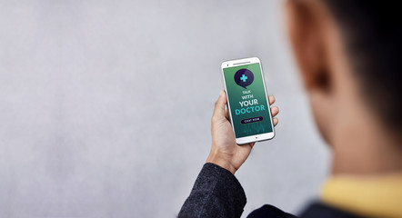Helathy Lifestyle and Technology Concept. Modern Businessman Using Online Medicine Application via Mobile Phone to Request a Consultation from the Doctor about his Health