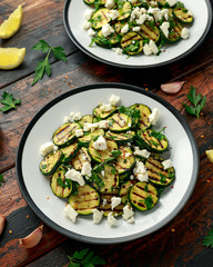 Warm salad with grilled zucchini, garlic and herbs