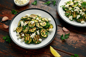 Warm salad with grilled zucchini, garlic and herbs