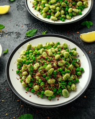 Vegan Green broad beans and quinoa salad with sweet peas and mint. Healthy food.
