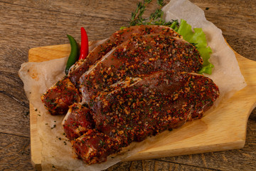 Raw marinated pork steak