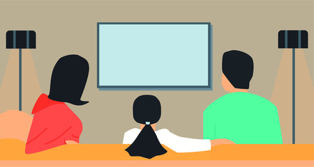 family watching tv on the couch