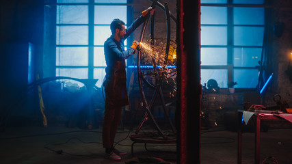 Talented Innovative Artist Uses an Angle Grinder to Make an Abstract, Brutal and Expressive Metal Sculpture in a Workshop. Contemporary Fabricator Creating Modern Steel Art.
