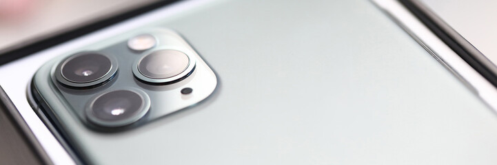 Fototapeta premium Camera of new gray smartphone closeup