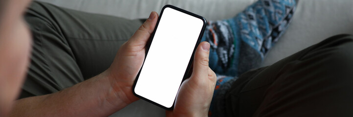 Male hand hold modern smartphone with blank scereen