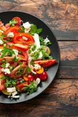 Tomato salad with feta cheese, spring onion and parsley. Healthy summer food
