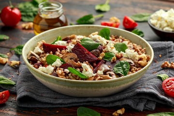 Buckwheat and beetroot salad with mushroom, walnut, spinach and feta cheese. healthy diet food