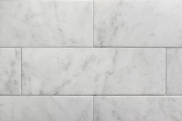 closeup of subway tile carrara marble wall background