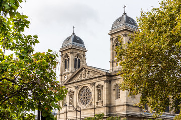 Fototapeta na wymiar Twin tower of St Francis Xavier's Church, a Roman Catholic church and parish in the 7th arrondissement of Paris dedicated to Francis Xavier.