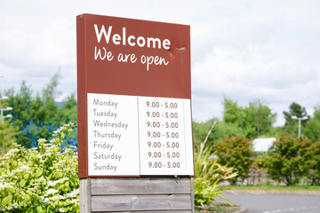 We are open sign with opening shop times