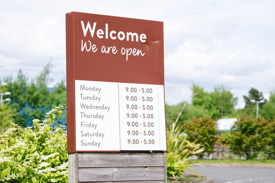 We are open sign with opening shop times