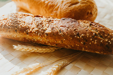 top view fresh homemade baked bread and sliced bread with milk on rustic white wooden table