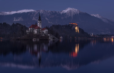Church Of Mary The Queen, Also Known As The Pilgrimage Church Of  Assumption Of Mary, Or Our Lady Of The Lake Bled At Winter « Blue Hour » With Karavanke Mountain Range  And Parish Church Of St.Martin - 352222951