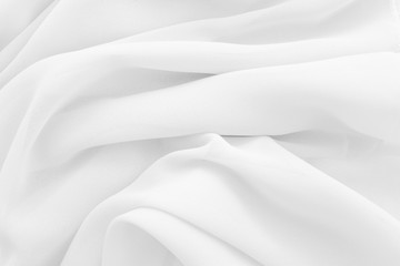 Obraz premium Luxury cloth texture with white fabric of silk for backdrop, wedding background. Seamless pattern of satin cotton.