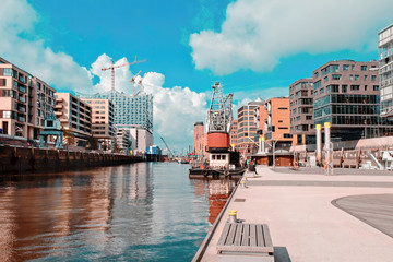 Hamburg Hafencity with crane under blue sky in summer