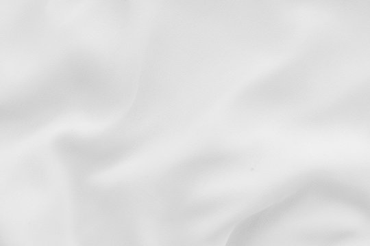 Luxury cloth texture with white fabric of silk for backdrop, wedding background. Seamless pattern of satin cotton.